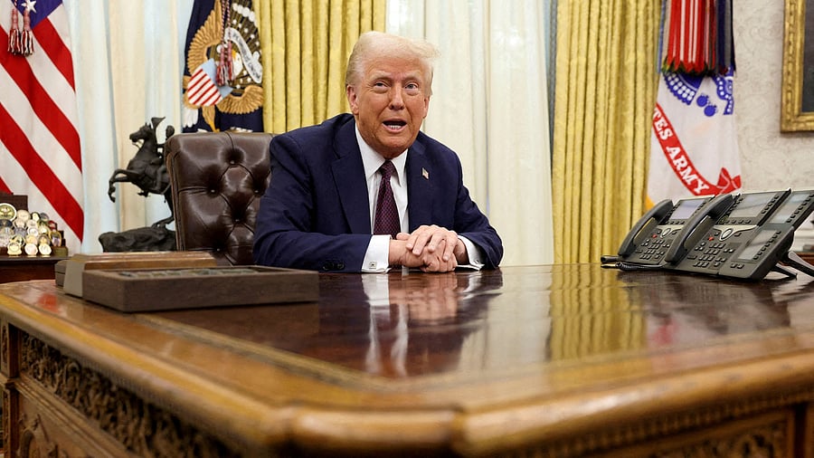 <div class="paragraphs"><p>US President Donald Trump sits in the Oval Office of the White House, as he signs executive orders, in Washington, US </p></div>
