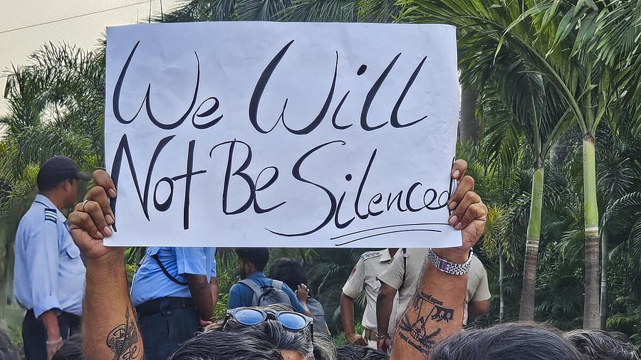 <div class="paragraphs"><p>An agitator holds a poster during a protest over the death of a Nepali student on the Kalinga Institute of Industrial Technology (KIIT) campus, in Bhubaneswar, Wednesday, Feb. 19, 2025.</p></div>