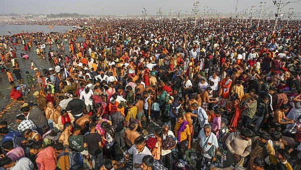 <div class="paragraphs"><p>Devotees take a holy dip in the Ganga river during the ongoing Maha Kumbh Mela festival, in Prayagraj,</p></div>