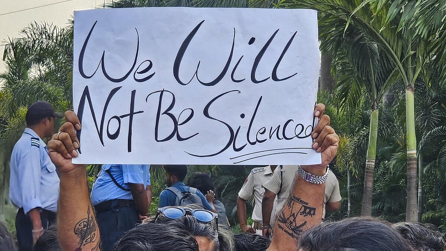 <div class="paragraphs"><p>An agitator holds a poster during a protest over the death of a Nepali student on the KIIT campus in Bhubaneswar</p></div>