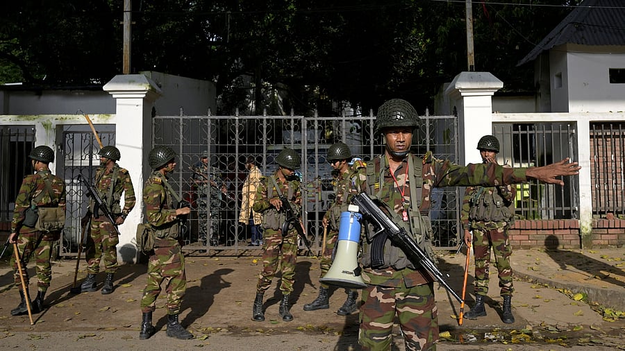 <div class="paragraphs"><p>Security personnel stand guard next to a police station in Dhaka, Bangladesh, August 9, 2024. Image for representational purposes.</p></div>
