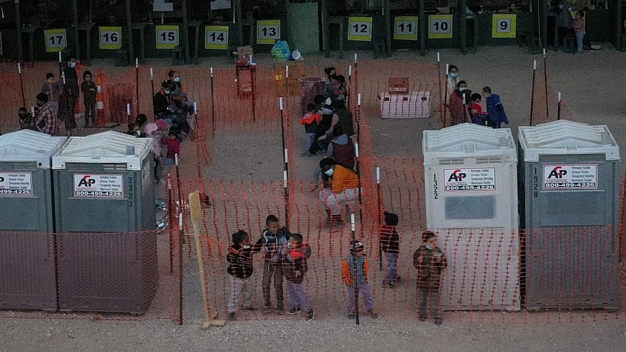 <div class="paragraphs"><p>Migrant children from Central America play in processing center under Anzalduas International Bridge in Granjeno, Texas</p></div>