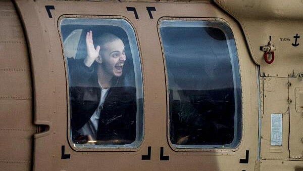 <div class="paragraphs"><p>Omer Wenkert, a hostage who was held in Gaza since the deadly October 7, 2023 attack, sits inside a helicopter after he was released from captivity as part of a hostages-prisoners swap and a ceasefire deal between Hamas and Israel. </p></div>