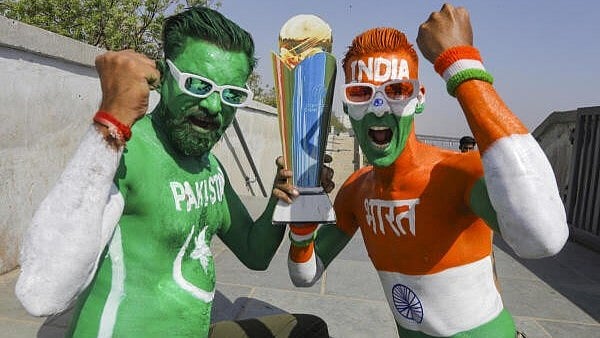 <div class="paragraphs"><p>Cricket fans with their bodies painted in the colours of the Indian and Pakistani national flags pose for photographs ahead of the Champions Trophy 2025 match between India and Pakistan.</p></div>