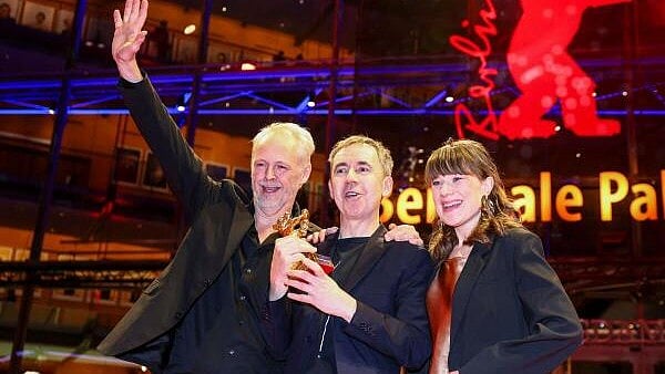 <div class="paragraphs"><p>Dag Johan Haugerud, Hege Hauff Hvattum and Yngve Saether pose with the Golden Bear for Best Film for "Dreams (Sex Love)" at the 75th Berlinale International Film Festival in Berlin, Germany.</p></div>