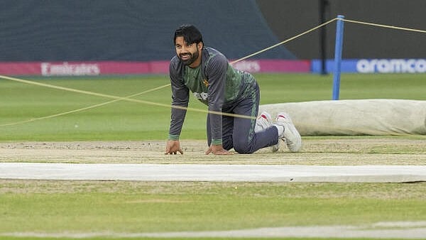 <div class="paragraphs"><p>Pakistan’s captain Mohammad Rizwan inspects the pitch during a practice session ahead of a One Day International (ODI) cricket match of the ICC Champions Trophy between India and Pakistan, at Dubai International Cricket Stadium, in Dubai. </p></div>