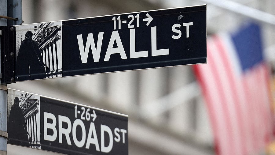 <div class="paragraphs"><p>A Wall Street sign hangs in front of a US Flag outside the New York Stock Exchange</p></div>