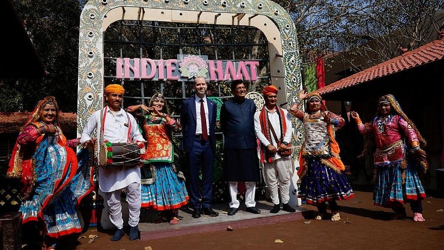<div class="paragraphs"><p>Indian Minister of Commerce and Industry Piyush Goyal and British Secretary of State for Business and Trade Jonathan Reynolds pose with traditional folk artists during a visit to the National Crafts Museum and Hastkala Academy in New Delhi.</p></div>