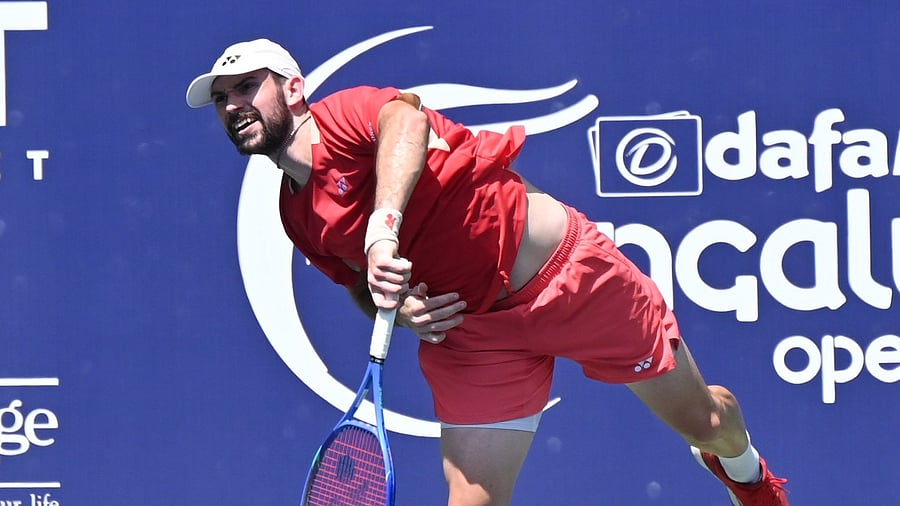 <div class="paragraphs"><p>Austria's Jurij Rodionov serves during his first round win over India’s Karan Singh in the Bengaluru Open at the KSLTA courts on Tuesday. </p></div>