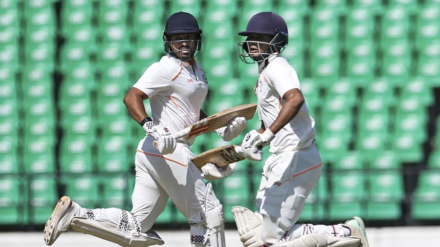 <div class="paragraphs"><p>Vidarbha's Karun Nair, left, and Danish Malewar run between the wickets on the first day of the Ranji Trophy final cricket match between Vidarbha and Kerala, at Vidarbha Cricket Association (VCA) Stadium, in Nagpur, Wednesday, Feb. 26, 2025.</p></div>
