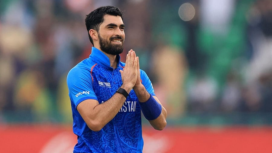 <div class="paragraphs"><p>Afghanistan's Ibrahim Zadran acknowledges the crowd and celebrates after reaching his century.</p></div>