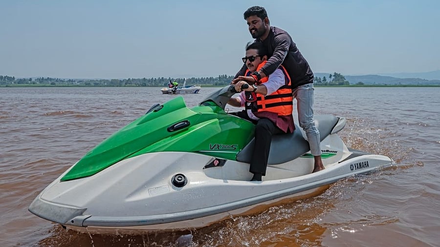 <div class="paragraphs"><p>District Minister B Z Zameer Ahmed Khan inaugurates water sports, as part of Hampi Utsav, by riding a water scooter, at Kamalapur lake near Hampi on Thursday.</p></div>