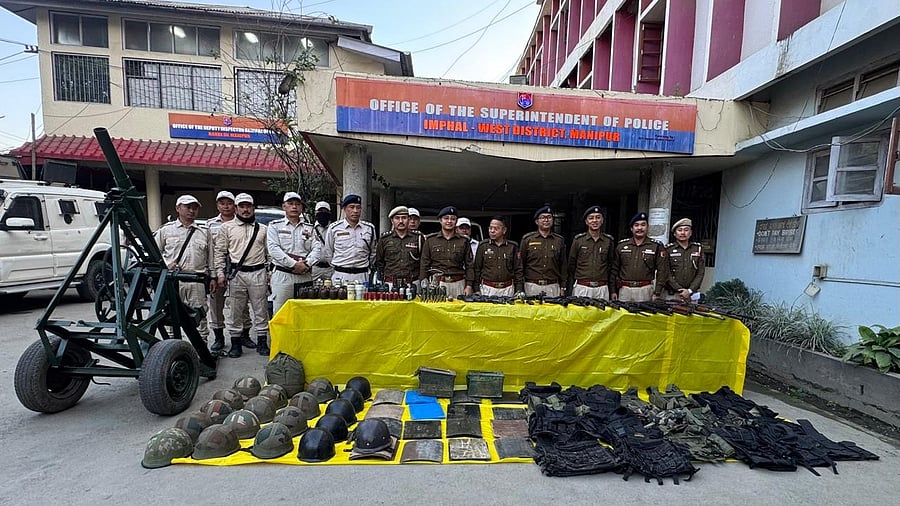 <div class="paragraphs"><p>Police officials seen along with the surrendered weapons.</p></div>