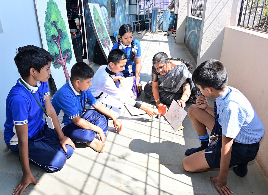<div class="paragraphs"><p>Science facilitator Usha Kulkarni explains the working of a simple sundial to students in front of the&nbsp;astronomy laboratory set up at St Antony’s Public School in Hubballi. </p></div>