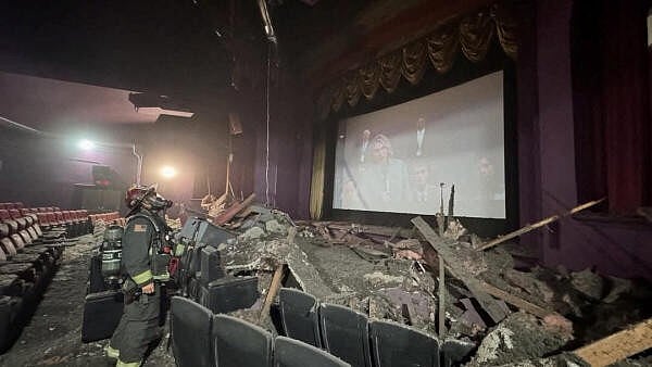 <div class="paragraphs"><p>A firefighter stands near debris on the ground after a ceiling collapsed at Liberty Cinema, in Wenatchee, Washington, US.</p></div>