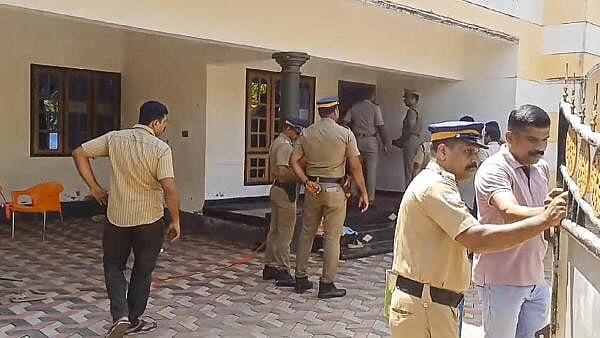 <div class="paragraphs"><p>Police investigate the crime scene after a 23-year-old man allegedly killed five people, including four of his close family members, in Thiruvananthapuram district</p></div>