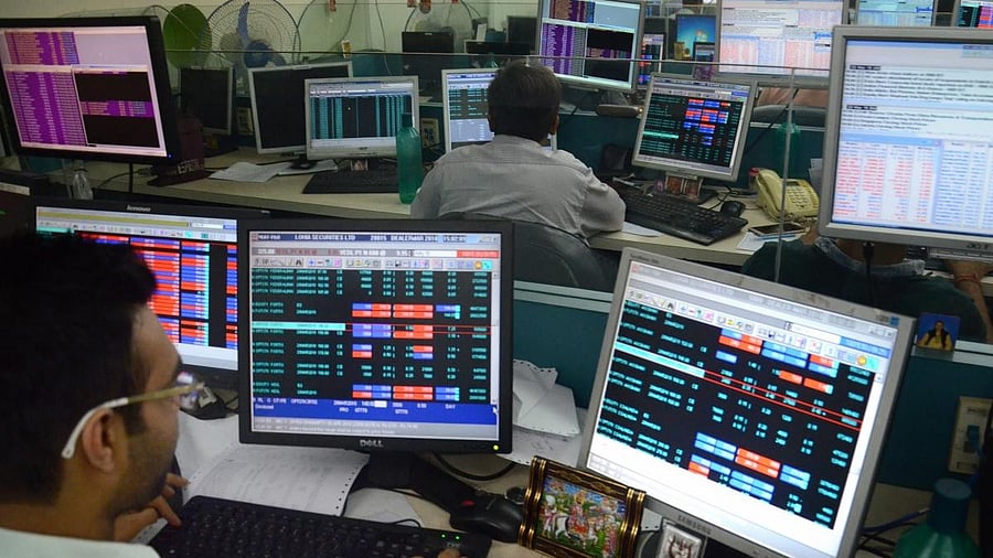 <div class="paragraphs"><p> Sharebrokers and holders check the Sensex and Nifty on Friday. </p></div>