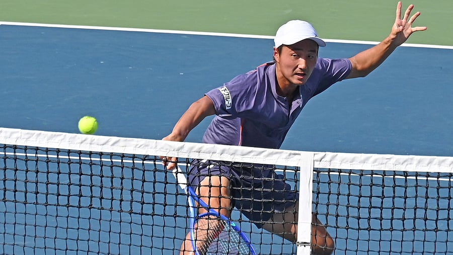 <div class="paragraphs"><p>Japan’s Shintaro Mochizuki plays a volley during his quarterfinal win over Czech Republic’s Hynek Barton in the Bengaluru Open on Friday. </p></div>