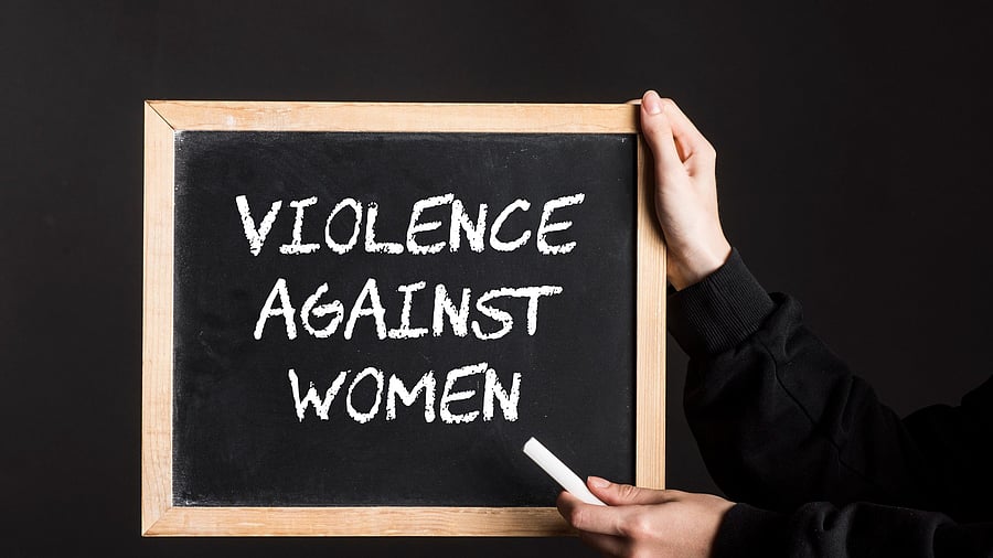 <div class="paragraphs"><p>Representative image with the text 'violence against women' written on a board</p></div>
