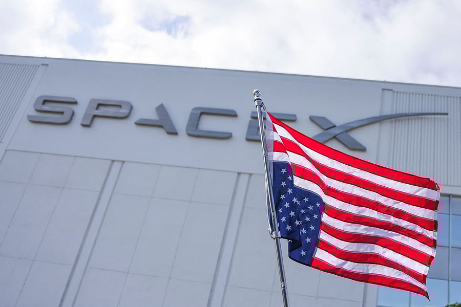 An upside-down U.S. flag flutters as activists hold a protest against cuts to government agencies by tech billionaire Elon Musk and his young aides at the cost-cutting Department of Government Efficiency , outside the SpaceX's facility in Hawthorne, California, U.S., March 1, 2025. REUTERS/David Swanson