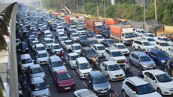 <div class="paragraphs"><p>Vehicles stuck in a traffic jam due to shifting and modification work of high-tension power cables at Delhi-Gurugram expressway</p></div>