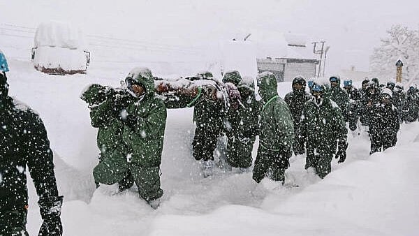 <div class="paragraphs"><p>Indian army personnel during a rescue effort following an avalanche that struck a camp near Mana village in Chamol district of Uttarakhand, on Friday.</p></div>