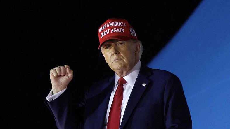 <div class="paragraphs"><p>US President Donald Trump pumps his fist as he steps from Air Force One upon his arrival in West Palm Beach, Florida, US, February 28, 2025.</p></div>