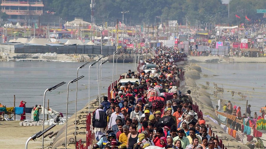 <div class="paragraphs"><p>Allahabad: Devotees cross a pontoon bridge on River Ganga as they arrive at Sangam ahead of Basant Panchami festival during Kumbh Mela festival</p></div>