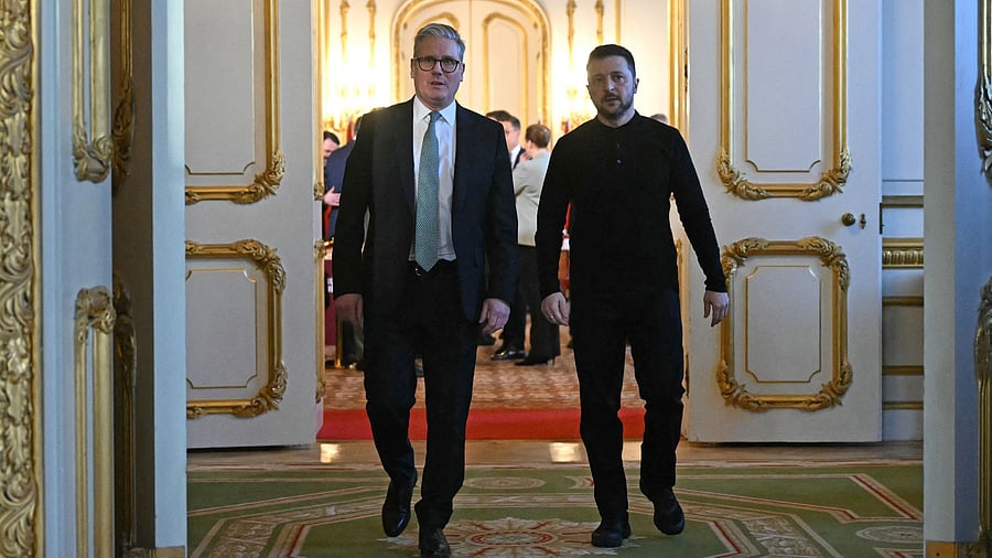 <div class="paragraphs"><p>Britain's Prime Minister Keir Starmer and Ukraine's President Volodymyr Zelenskyy head to a private room to hold a meeting during a summit at Lancaster House in central London, Britain March 2, 2025.</p></div>