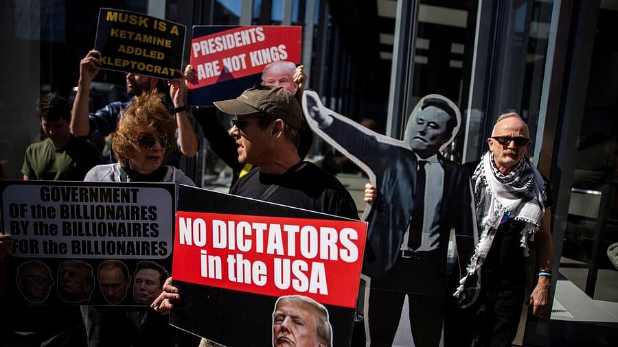 <div class="paragraphs"><p>People protest outside of a Tesla store during a National Day of Tesla Protest in New York City, US, March 1, 2025.</p></div>
