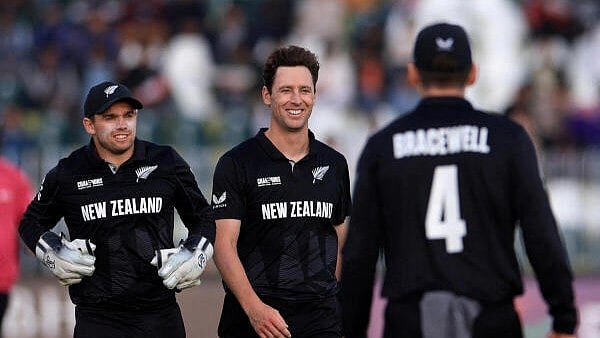 <div class="paragraphs"><p>New Zealand's Matt Henry celebrates with teammates after taking the wicket of Bangladesh's Rishad Hossain,</p></div>