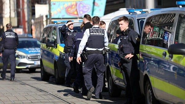 <div class="paragraphs"><p>Police talk near the scene after a car drove into a crowd, in Mannheim, Germany, March 3, 2025.</p></div>
