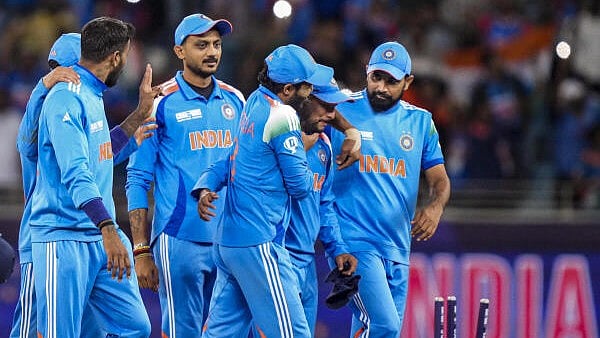<div class="paragraphs"><p>Indian players celebrate after winning the ICC Champions Trophy cricket match over New Zealand, in Dubai, UAE, on Sunday</p></div>