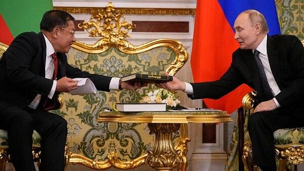 <div class="paragraphs"><p>Myanmar's military chief Senior General Min Aung Hlaing (L) presents a book to Russia's President Vladimir Putin (R) during a meeting in Moscow, Russia.</p></div>