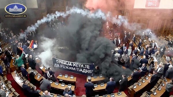 <div class="paragraphs"><p>Serbian opposition lawmakers let off smoke grenades inside Serbian parliament, in Belgrade, Serbia March 4, 2025,</p></div>
