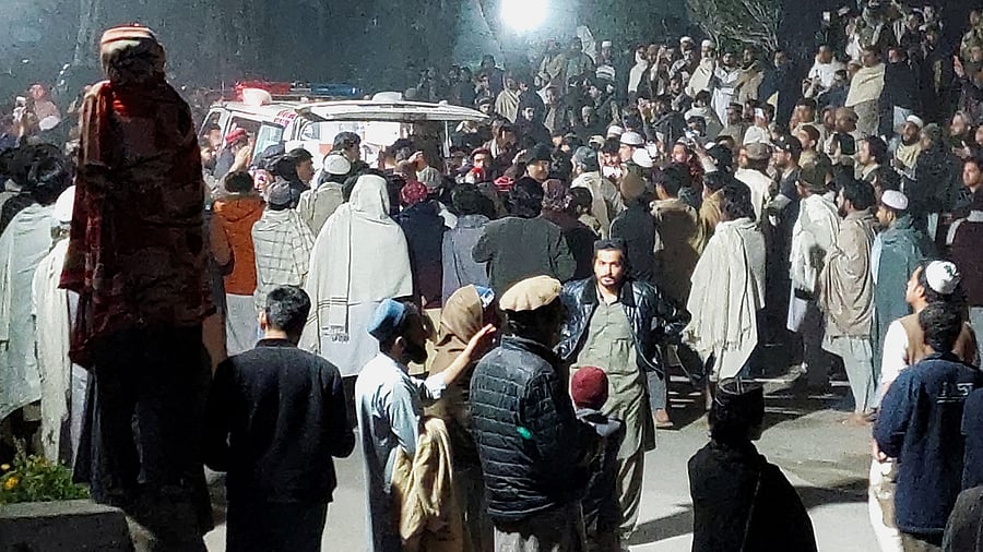 <div class="paragraphs"><p>People gather near an ambulance outside a hospital after a suicide bombing in Bannu, Pakistan March 4, 2025.</p></div>