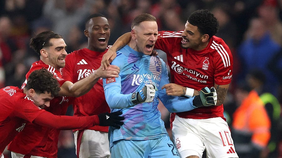 <div class="paragraphs"><p>Nottingham Forest's Matz Sels and Morgan Gibbs-White with teammates celebrate after the match.</p></div>