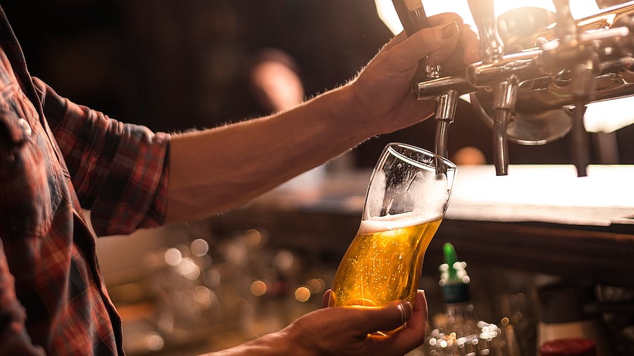 <div class="paragraphs"><p>Bartender pureeing beer from a tap test.</p></div>