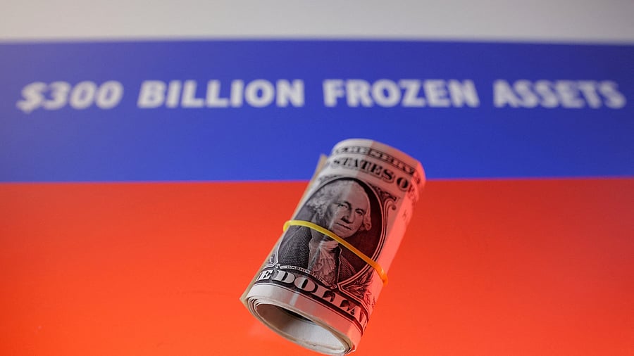 <div class="paragraphs"><p>U.S. dollar banknotes and Russian flag with words "$300 billion frozen assets" are seen in this illustration</p></div>