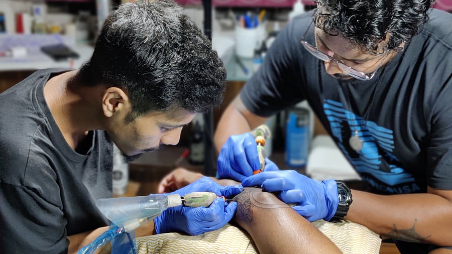 Tattoo artists at work at Dark Arts The Tattoo Studio, Koramangala.