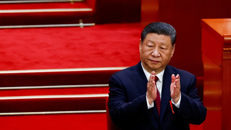 <div class="paragraphs"><p>Chinese President Xi Jinping applauds as Premier Li Qiang (not pictured) delivers a speech on the day of the opening session of the National People's Congress (NPC), at the Great Hall of the People, in Beijing, China March 5, 2025.</p></div>