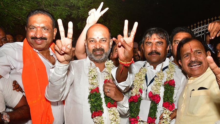 <div class="paragraphs"><p>Bandi Sanjay celebrates with BJP workers after MLC poll victories</p></div>