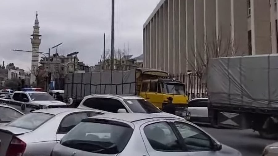 <div class="paragraphs"><p>Screengrab shows trucks loaded with cash entering the Central Bank of Syria under tight security protection.</p></div>