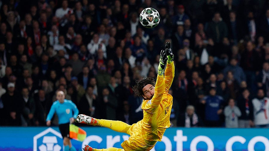 <div class="paragraphs"><p>Liverpool goalkeeper Alisson Becker makes a save against PSG.</p></div>