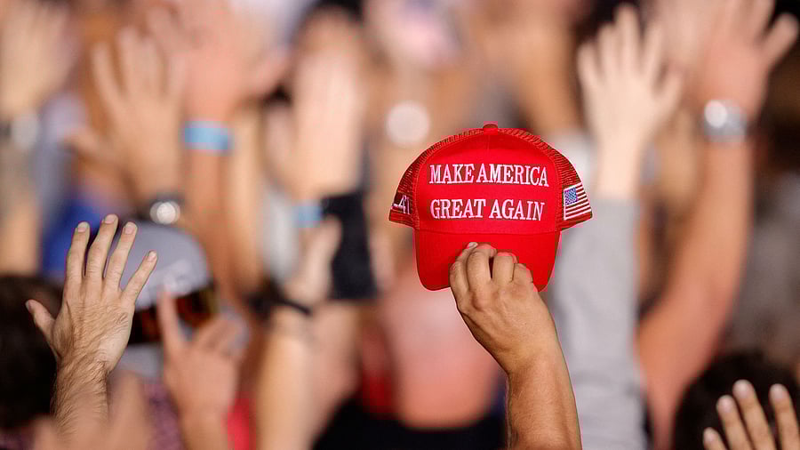 <div class="paragraphs"><p>A supporter  US President Donald Trump holds a MAGA hat.&nbsp;</p></div>
