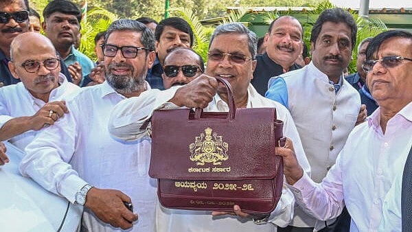 <div class="paragraphs"><p>Karnataka Chief Minister Siddaramaiah arrives to present the state Budget 2025-26, in Bengaluru on Friday</p></div>
