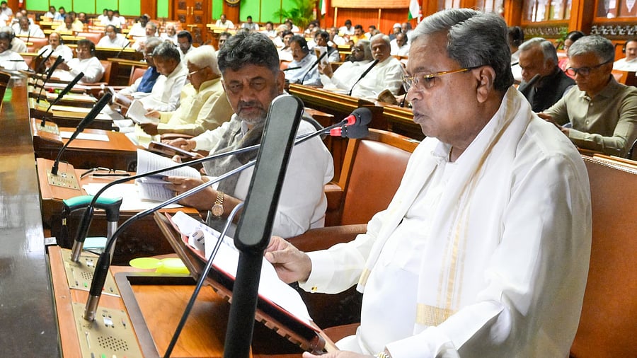 <div class="paragraphs"><p>DKS looks on as Siddaramaiah presents the Budget.</p></div>