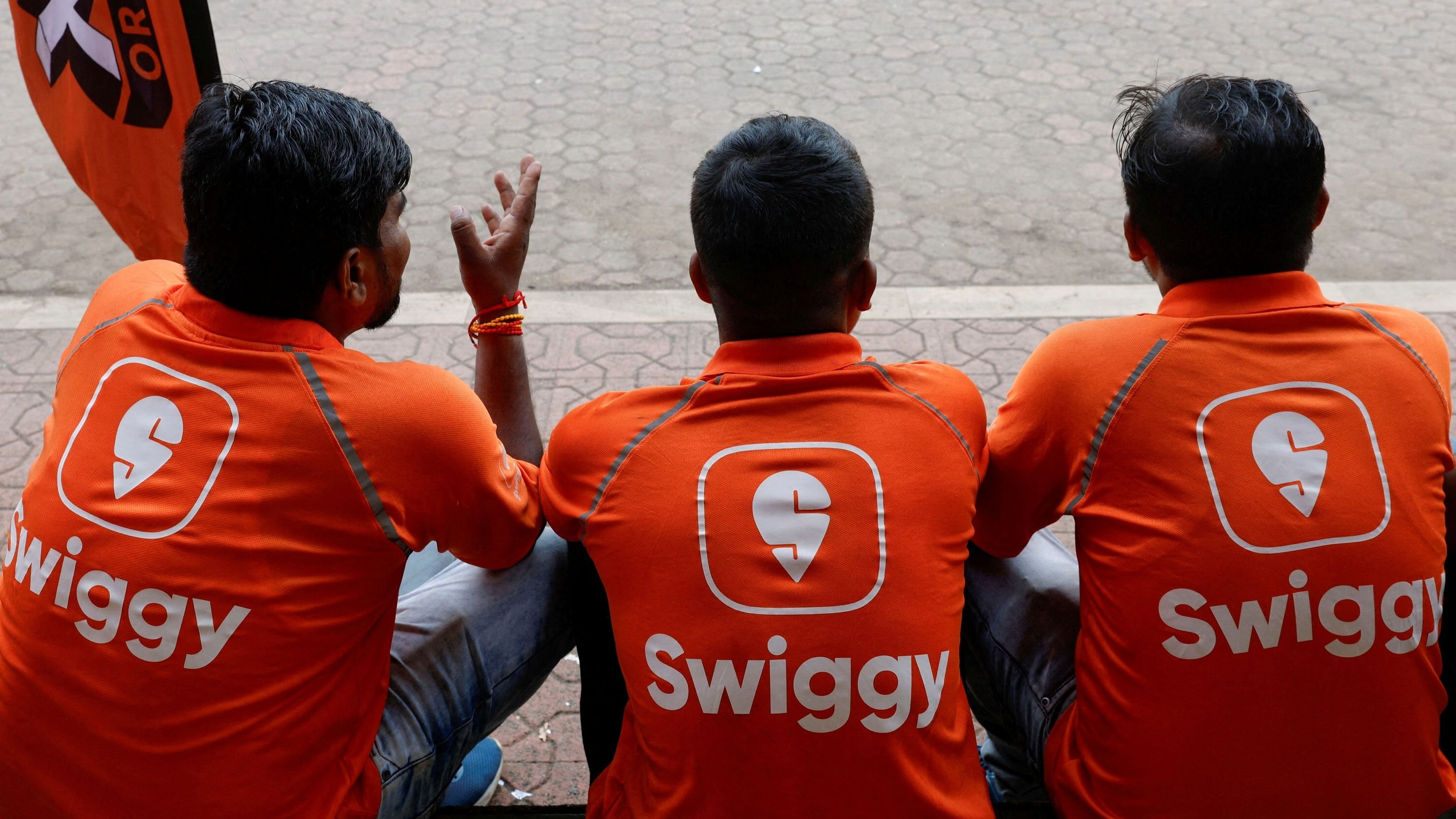 <div class="paragraphs"><p>Swiggy gig workers talk to each other.</p></div>