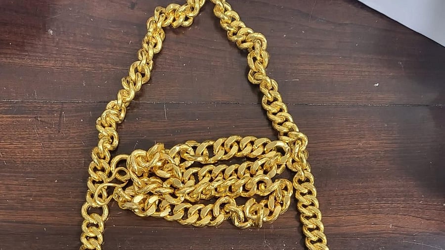 Officers discovered 3.995 kg of gold concealed under the suspect's shirt. Bengaluru Air Customs  