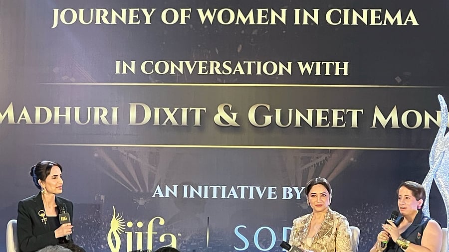 <div class="paragraphs"><p>Madhuri Dixit Nene and Guneet Monga at IIFA's 'journey of women in cinema' panel.</p></div>